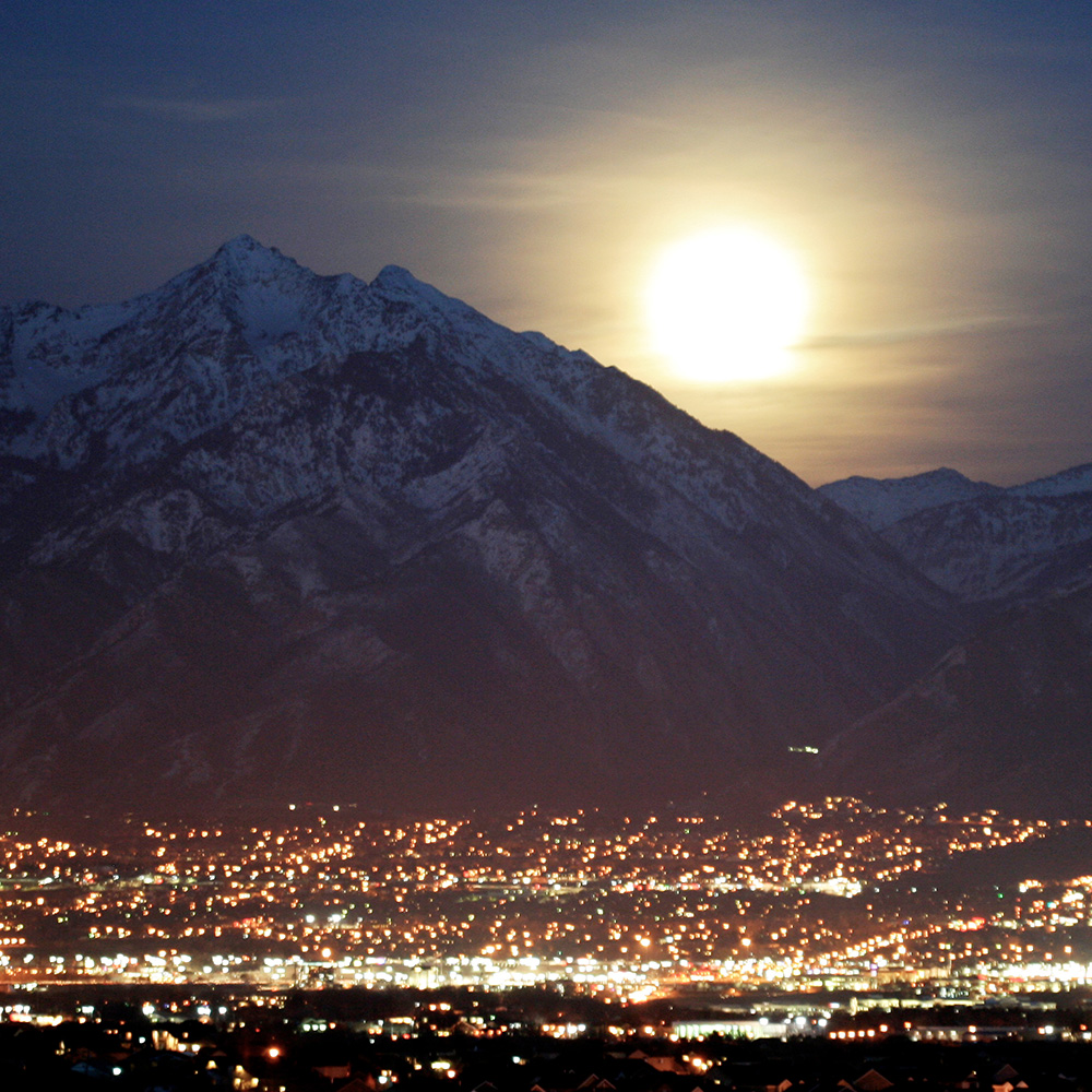 city lights, mountains, bright moon 