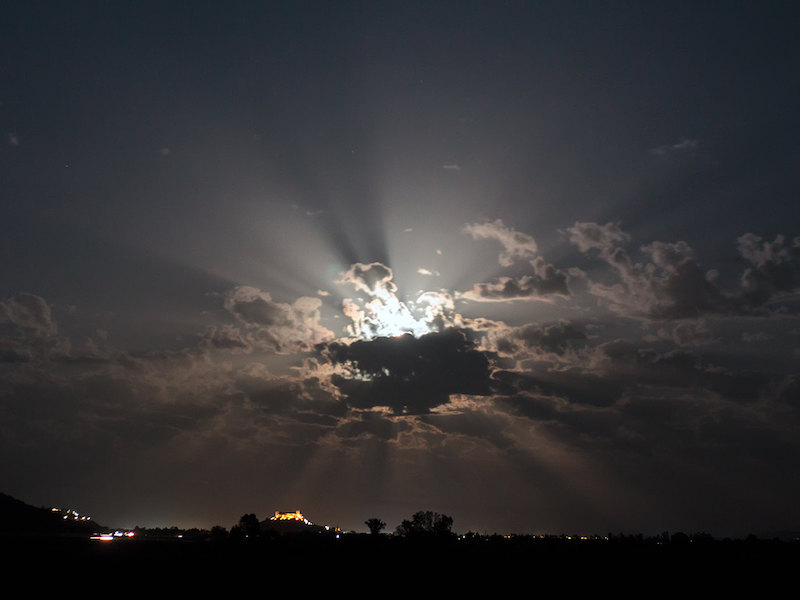 Moonlight through a cloud, producing dramatic crepuscular rays