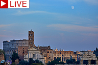 Photo of sky at dusk with Moon over Rome Colliseum
