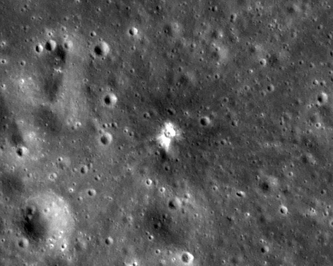 In the second image, the same landscape is interrupted by a small, bright white crater.