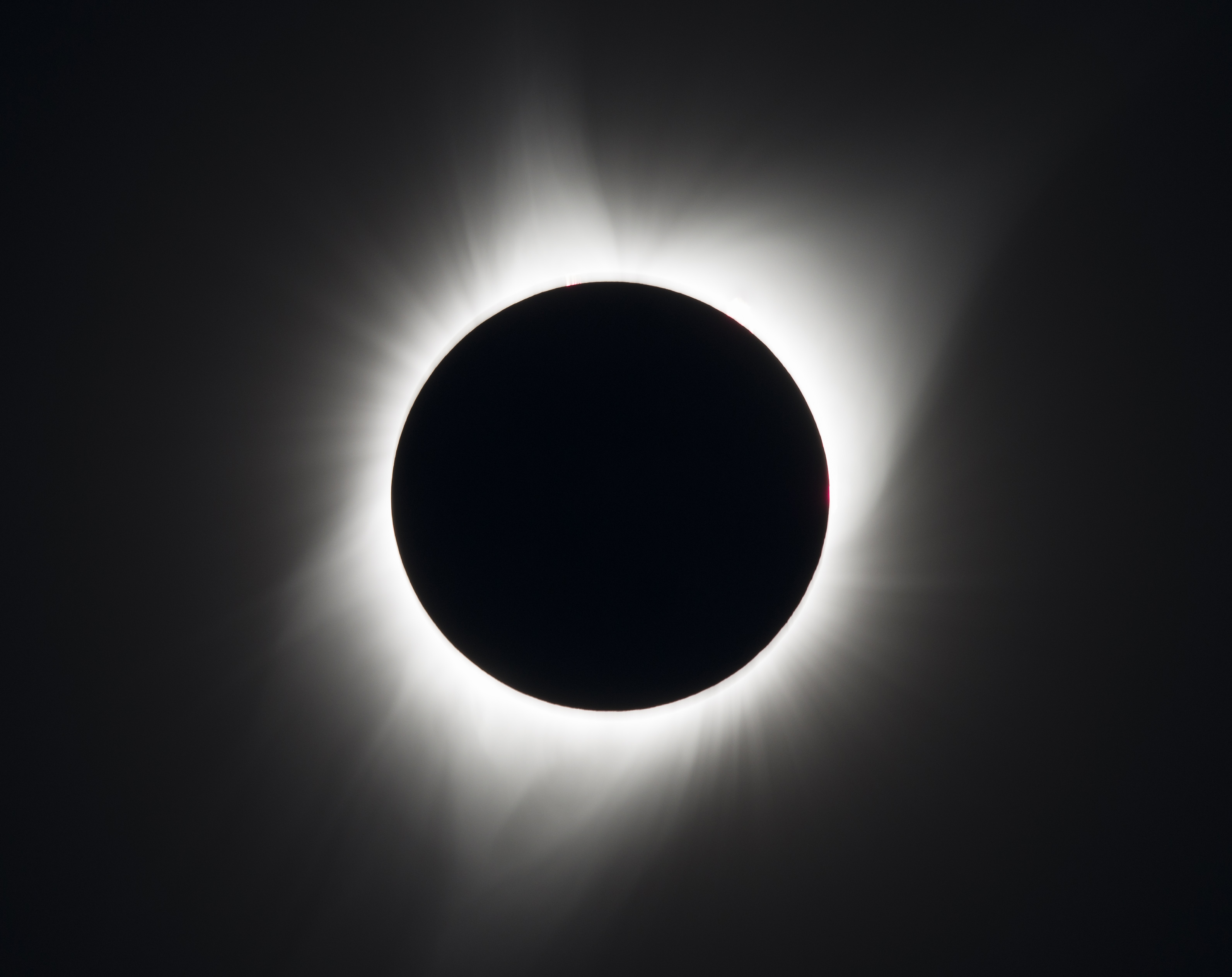 sun blocked by moon in total eclipse, with just corona visible
