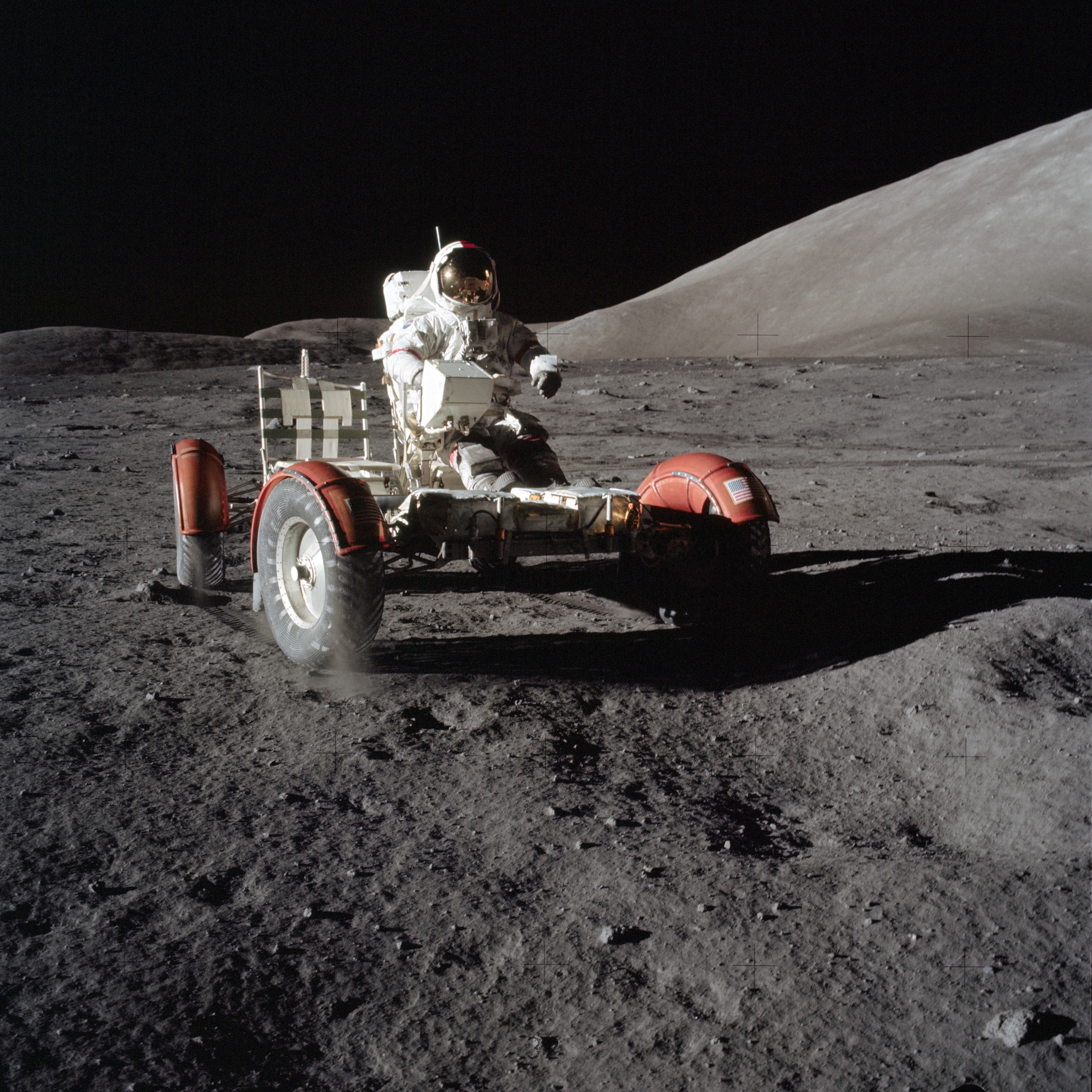 Apollo 17 was the final mission of NASA's Apollo program, the most recent time humans have set foot on the Moon. This image shows an astronaut in the Lunar Excursion Module (LEM) within the Taurus-Littrow Valley. A key scientific goal of the mission was to collect rock samples from the Serenitatis basin rim to find out exactly how old it is.