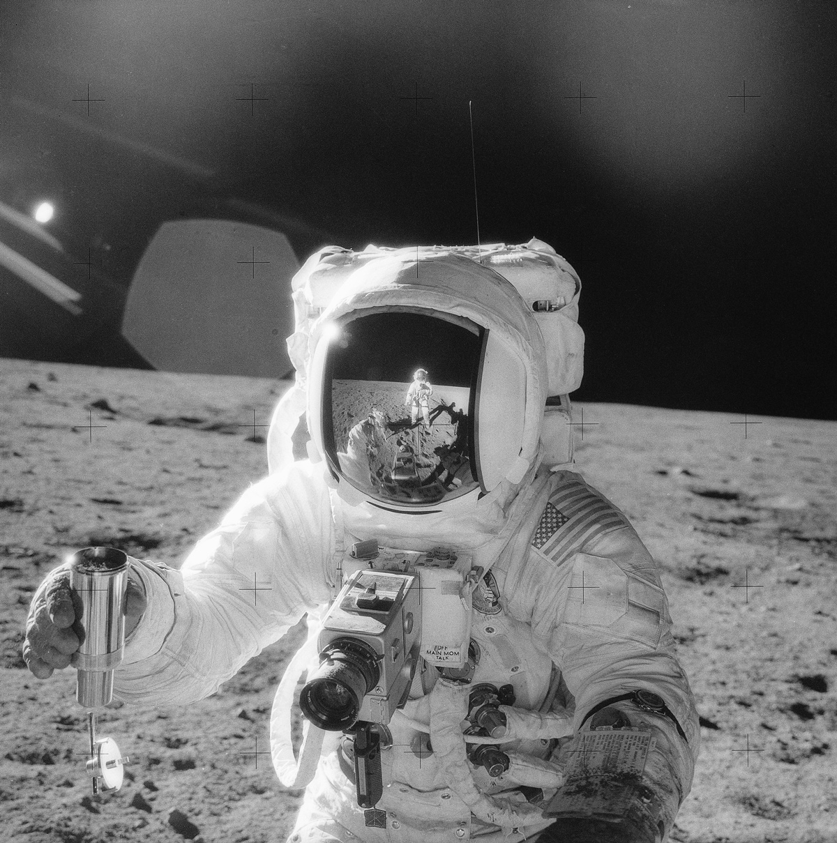 Astronaut collecting rock samples on the moon