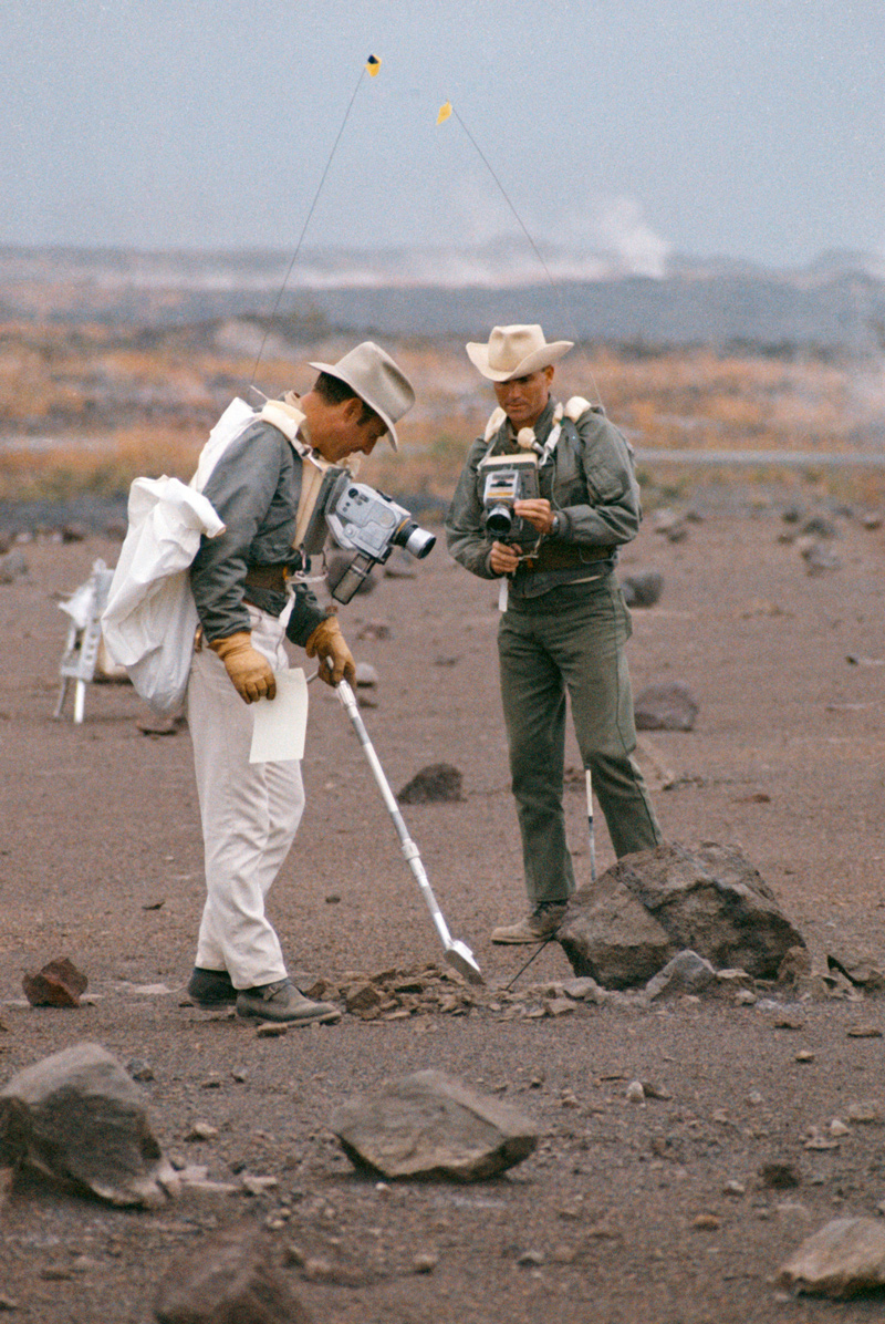 Two men performing simulation of lunar traverse