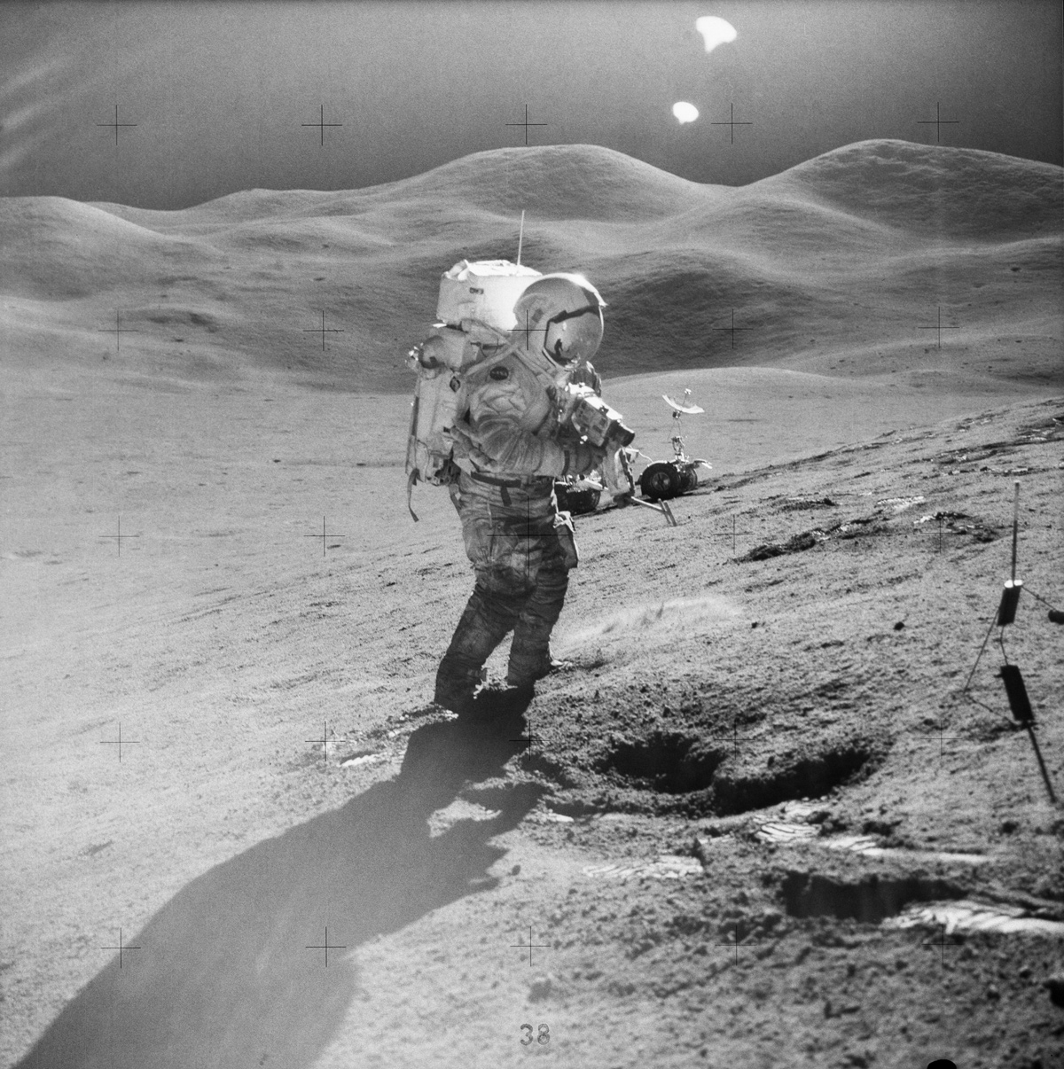 Astronaut photographing the lunar surface