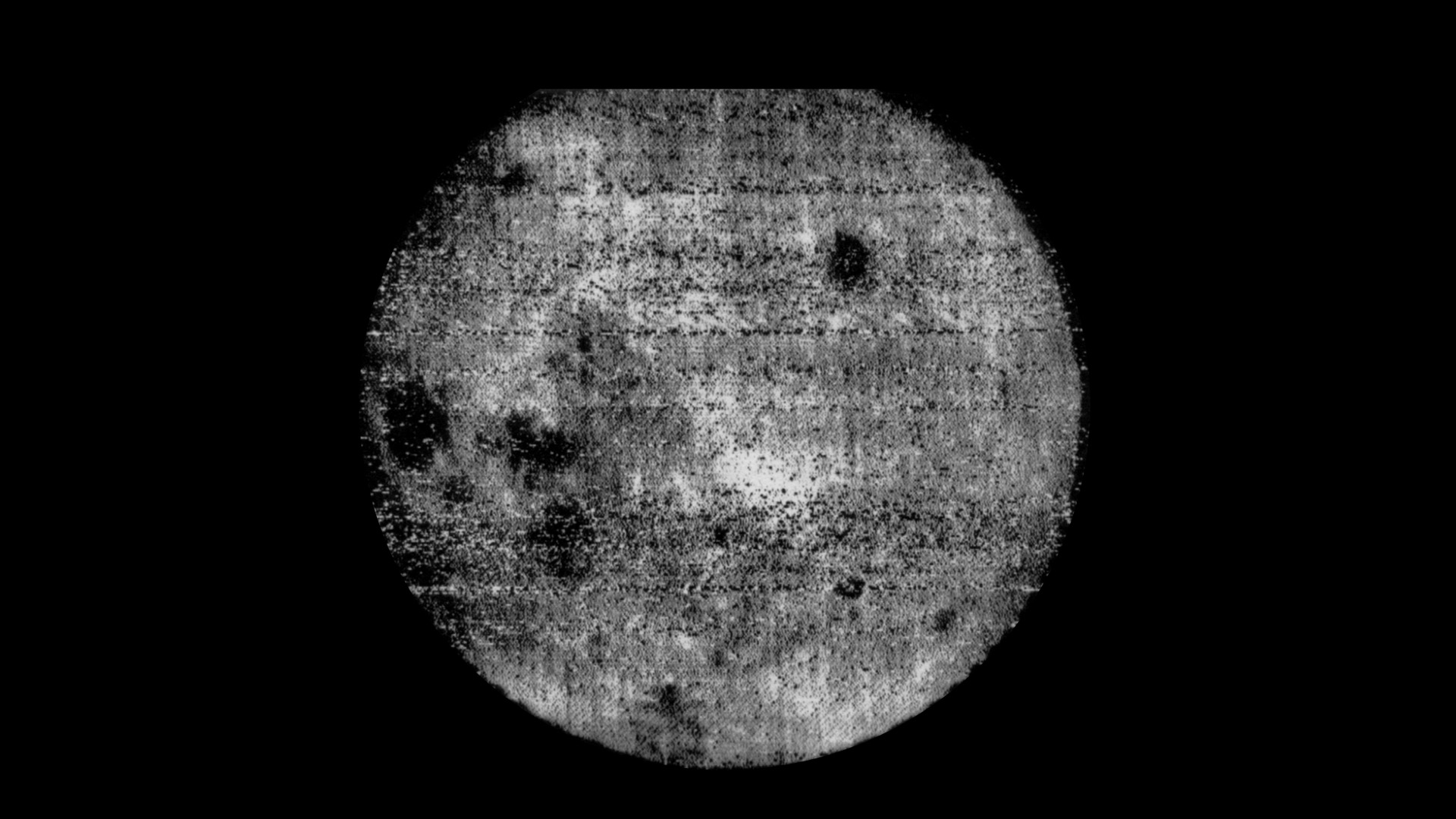 Fuzzy black and white image of the Moon.