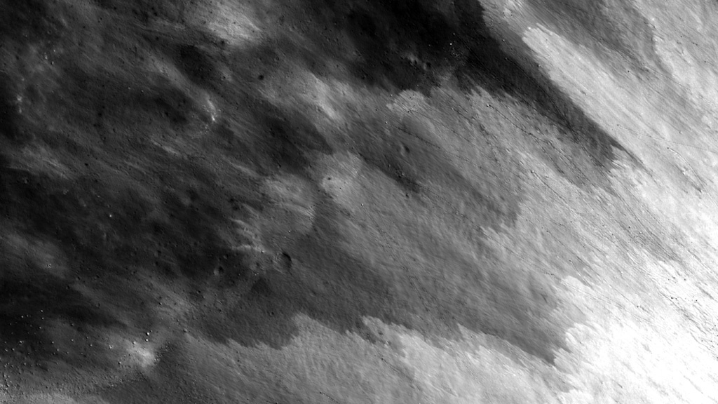 Debris from unnamed impact crater near crater Darwin C.