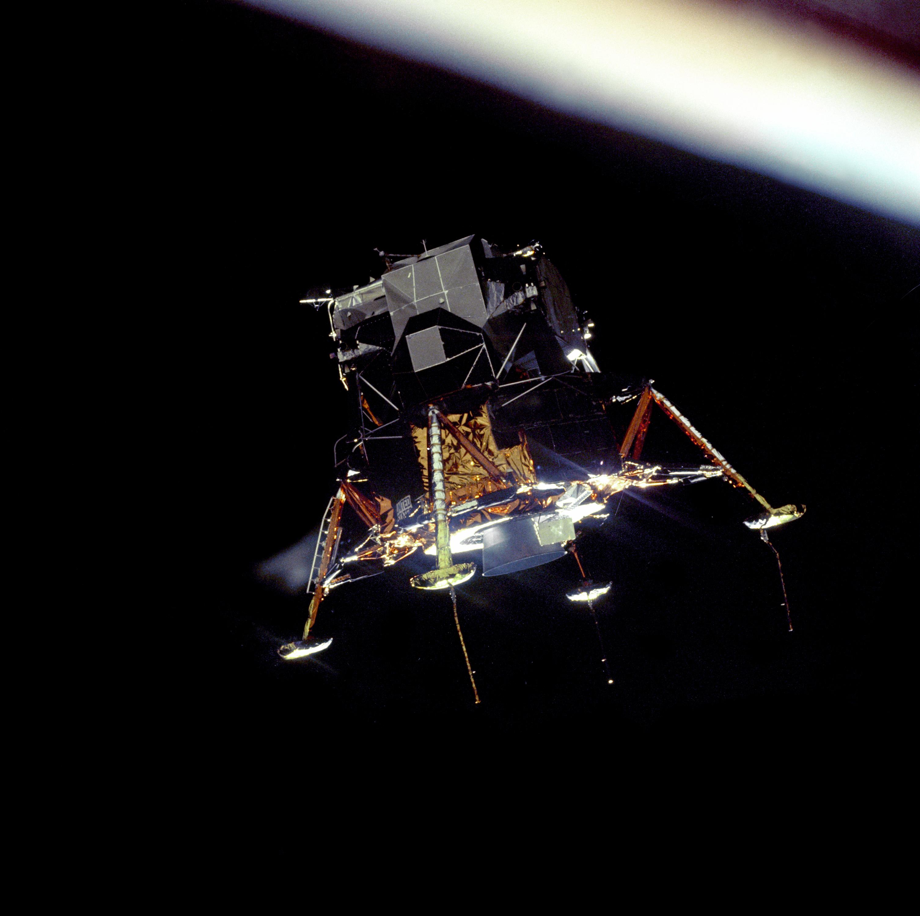 Lunar landing module above the Moon.
