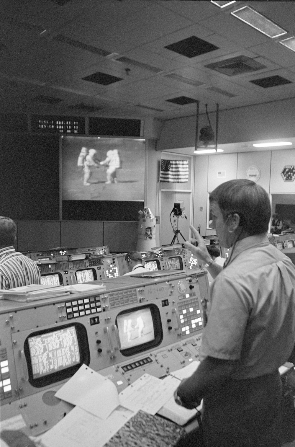 Apollo 15 flight director standing in Mission Control Center