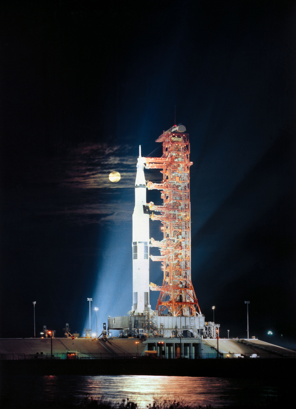 Spacecraft on launchpad with full moon in background