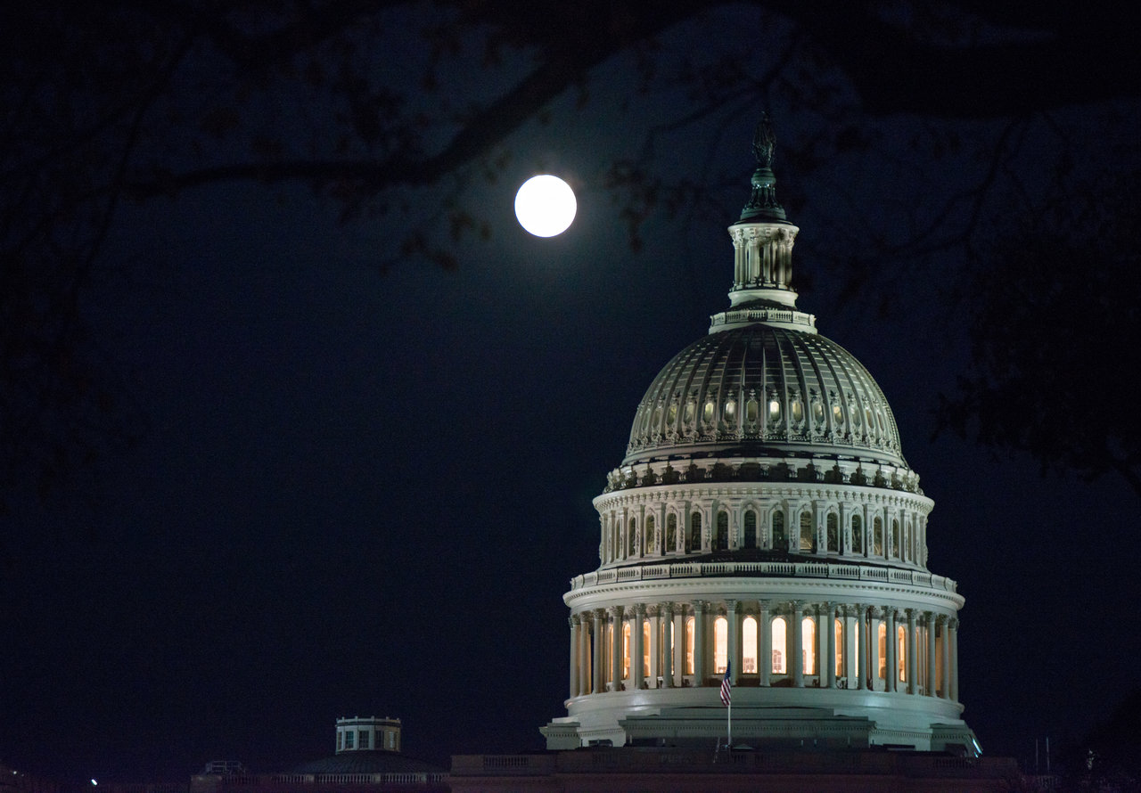 Moon above U.S. Capitol.