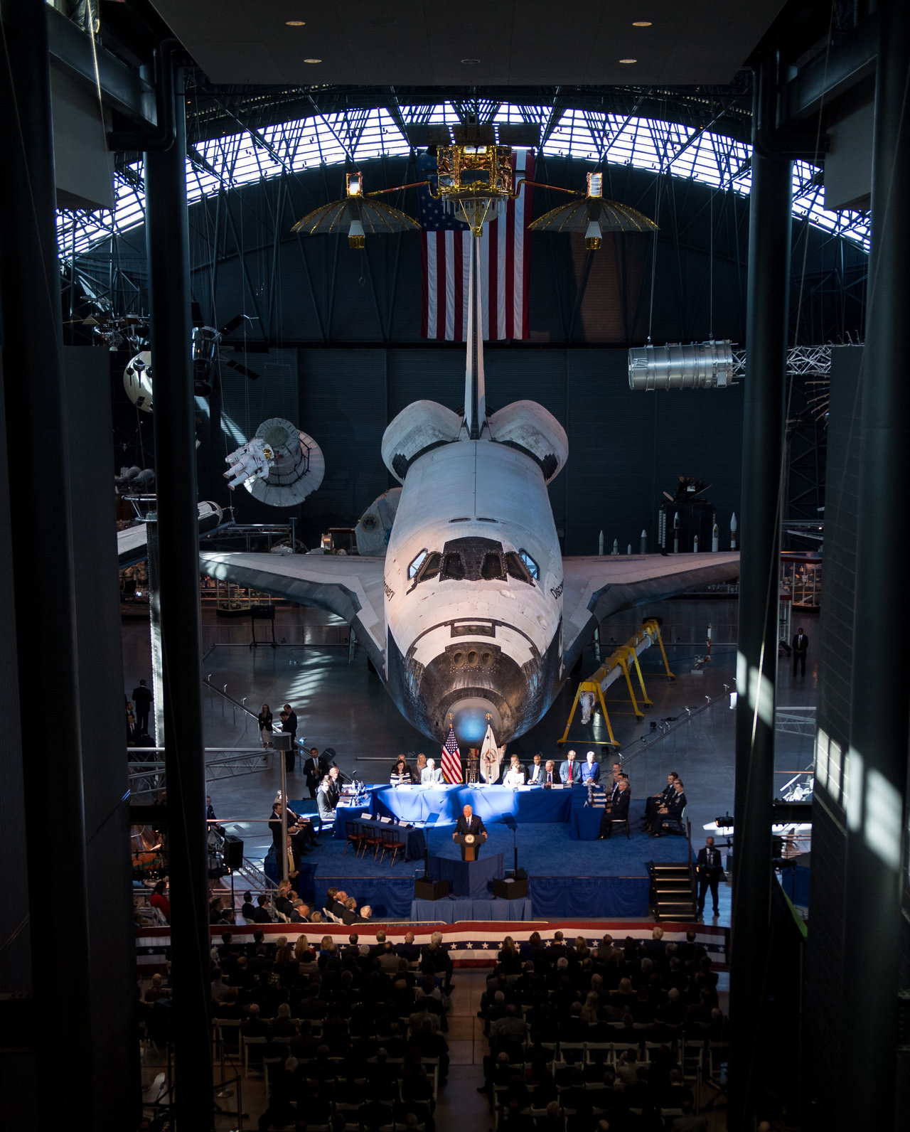 Color image of Vice President giving a speech in front of the Space Shuttle at the Smithsonian.
