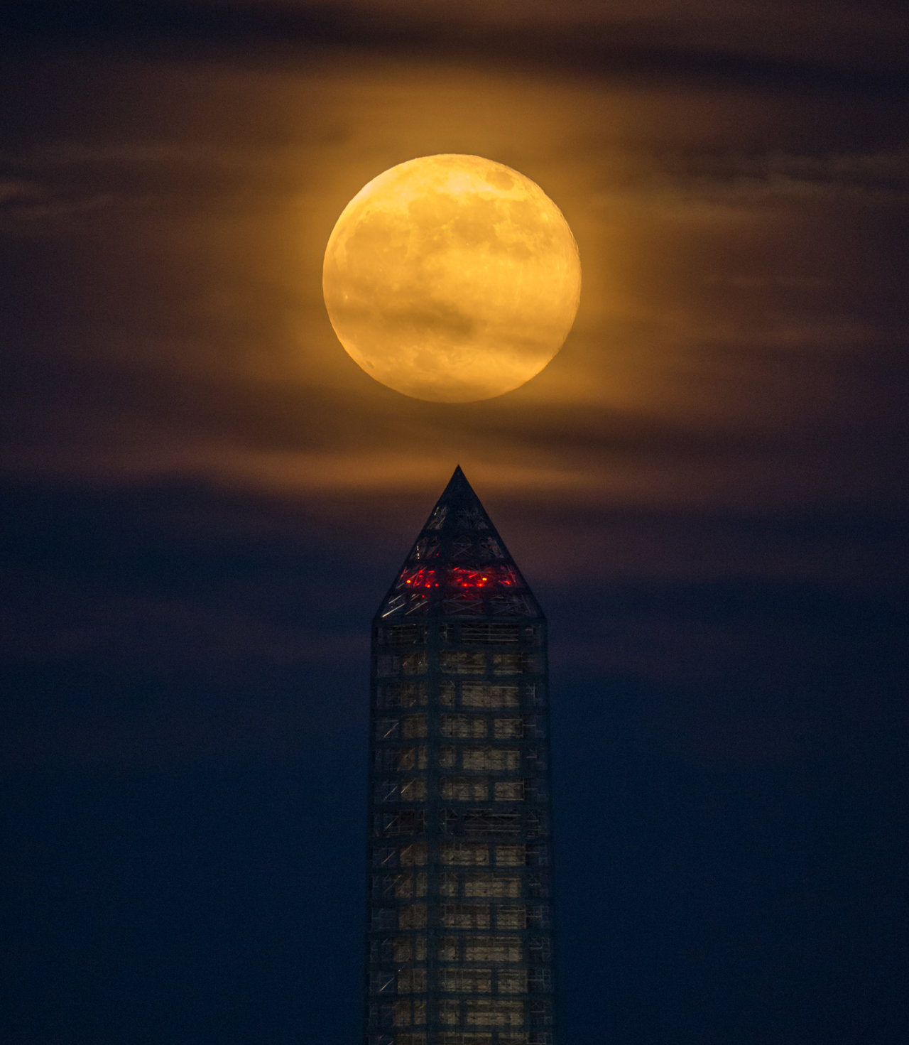A supermoon rises behind the Washington Monument, Sunday, June 23, 2013, in Washington.