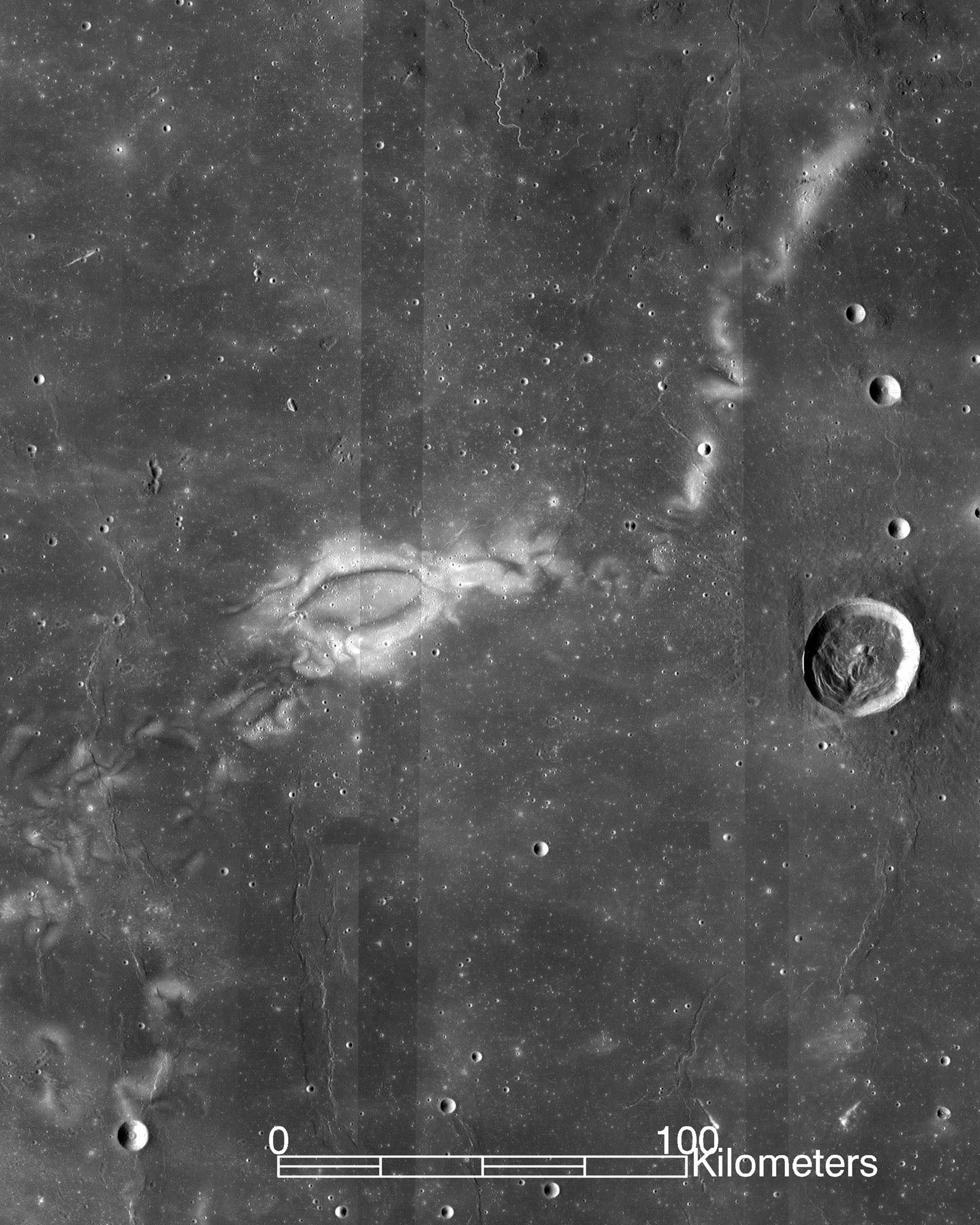 Black and white image of whitish swirls on the surface of the moon.